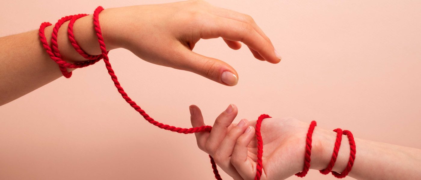 human-hands-connected-with-red-thread
